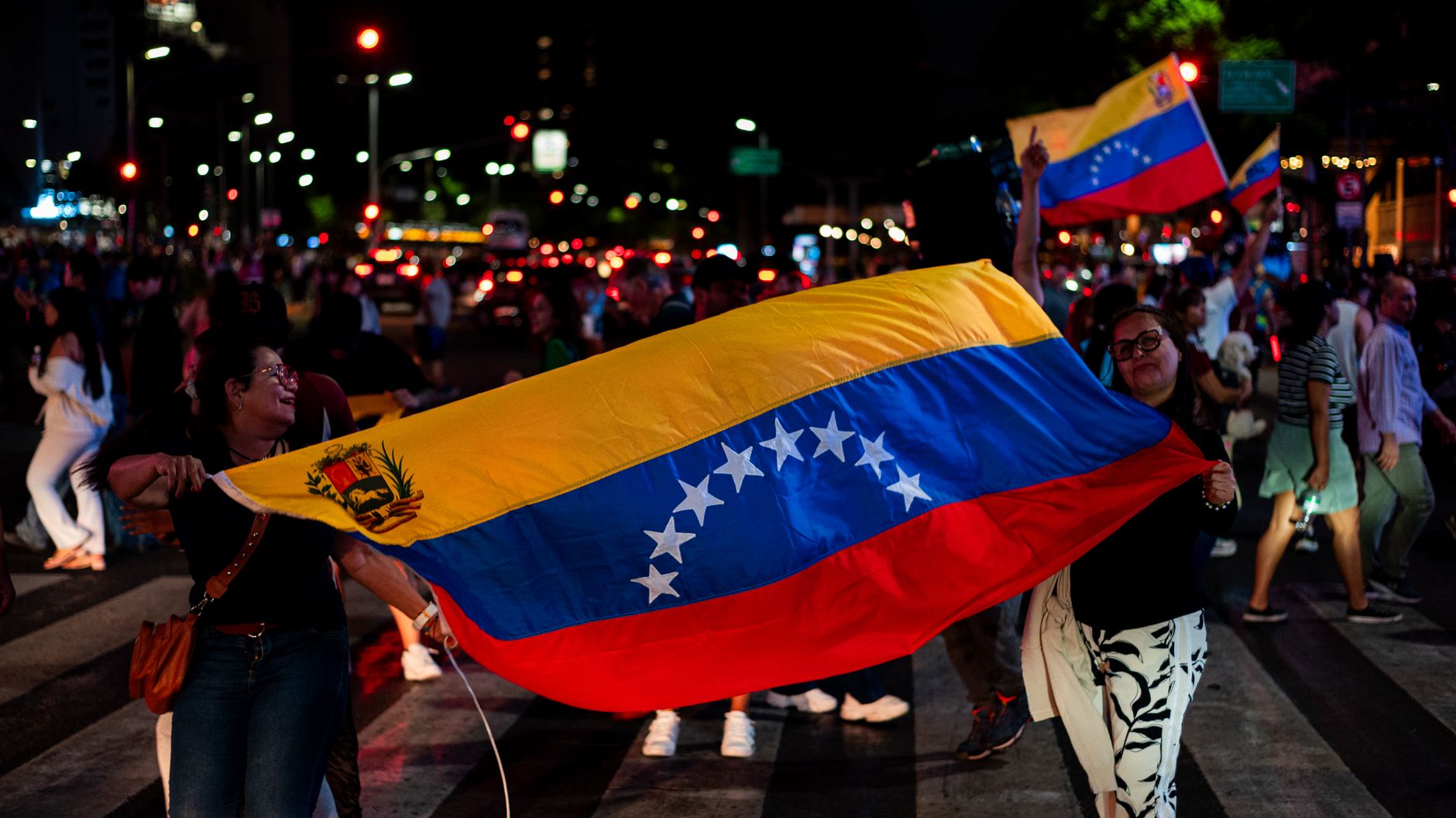 venezuelan flag waving at night in buenos aires